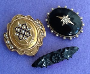 Mourning locket and broaches